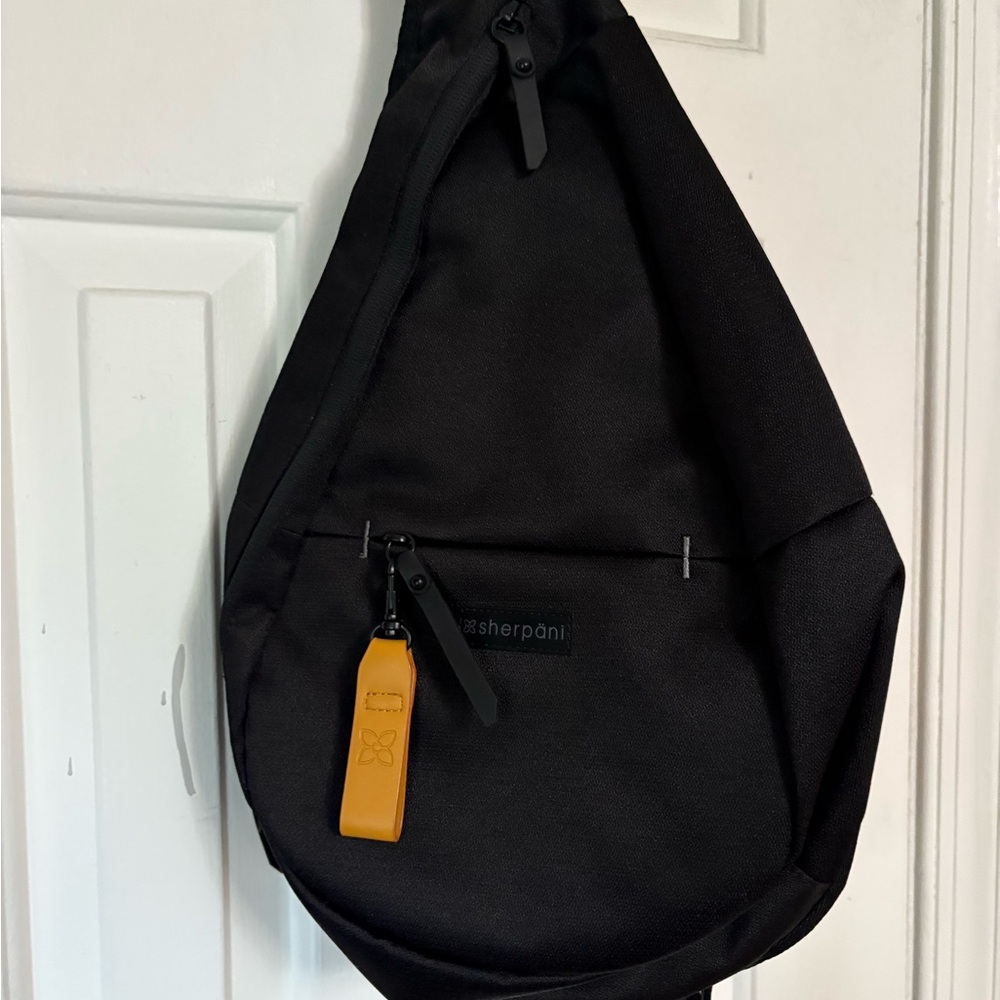 NWOT Sherpani Black Sling Bag